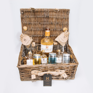 A beautifully arranged gin lovers hamper filled with a variety of premium gins, botanicals, and garnishes.