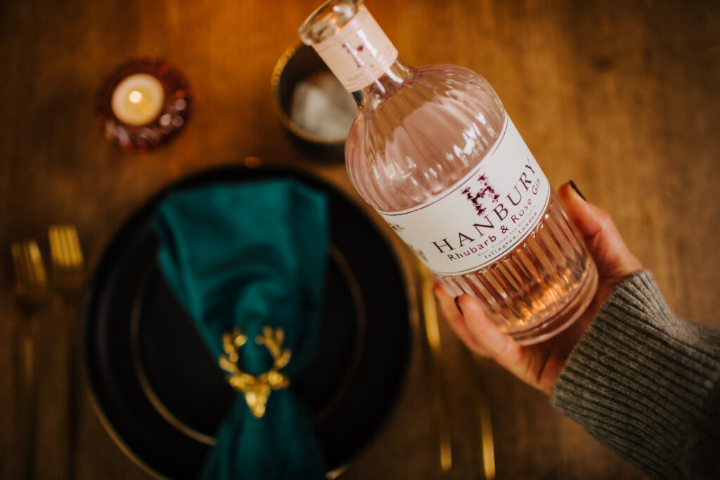 Pouring a glass of Hanbury Rhubarb and Rose Gin.