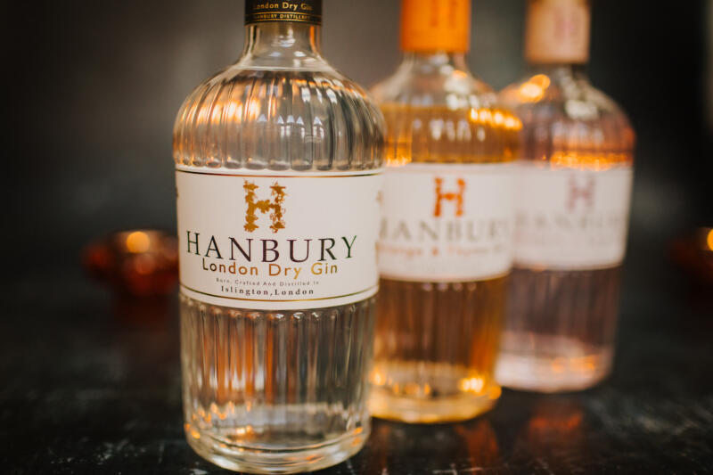 Hanbury Gin Distillery presents its exquisite range of gin flavours: Rhubarb and Rose, London Dry Gin, and Orange & Thyme Gin